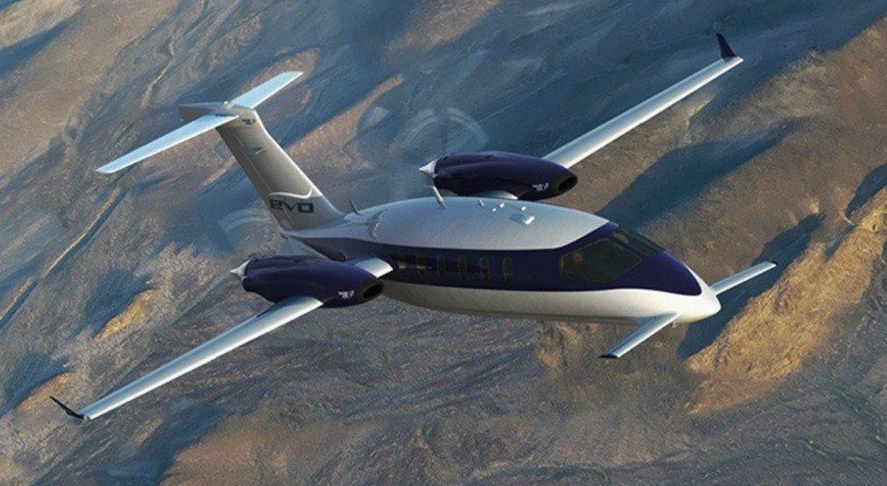 Piaggio Avanti EVO in flight over desert mountains