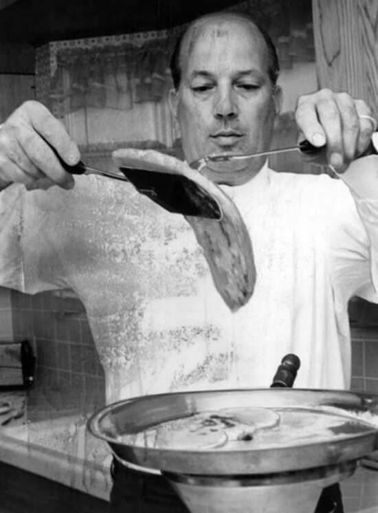 Grandfather cooking in the kitchen, vintage black and white photograph